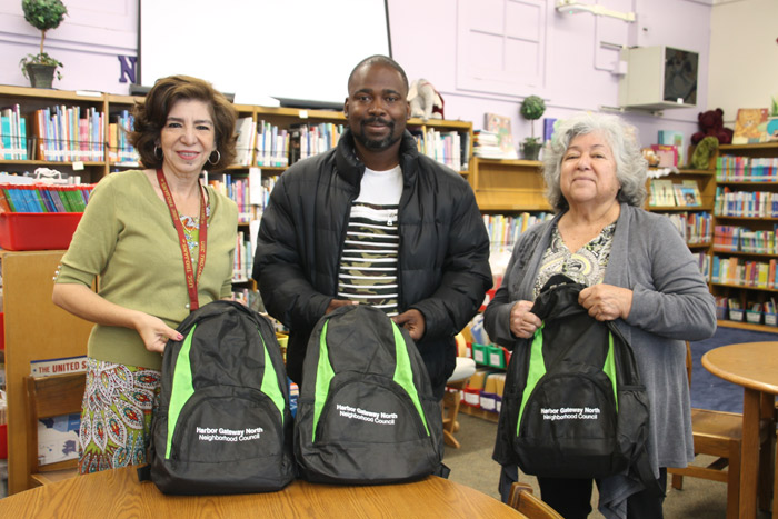 HGNNC delivers backpacks to schools