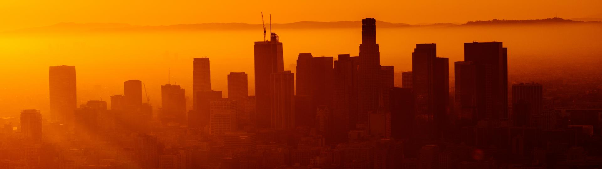 downtown sillouetted against orange sky